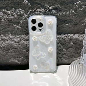 Detail van wit iPhone-hoesje met 3D-glittervlinders en bloemen in reliëf