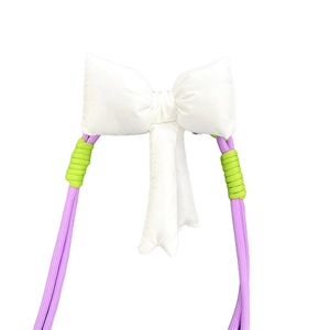 Adjustable crossbody phone strap with large white bow and purple braided cord design