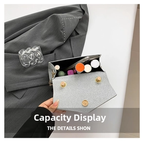 Macro view of silver glitter crossbody bag interior showing phone and lipsticks capacity