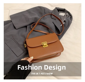 Close-up of caramel brown shoulder bag featuring a vintage gold square twist lock clasp