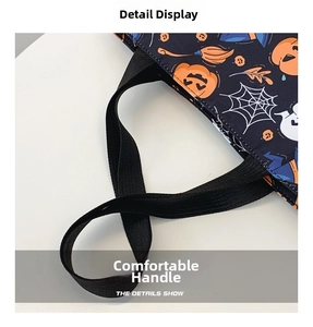 Close-up of sturdy black woven handle on Halloween tote bag with pumpkin and ghost prints
