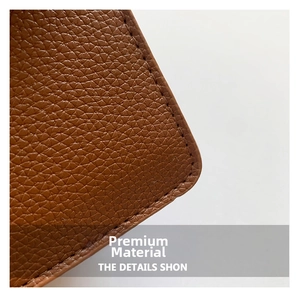Close-up of brown litchi pattern leather texture and premium hand-stitched craft details
