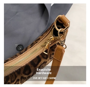 Close-up of leopard print faux fur texture with premium gold metal zipper and leather strap