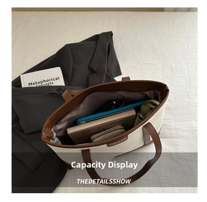 Detail view of large canvas tote bag interior showing spacious capacity for tablets and books
