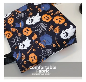 Detail view of the Halloween tote bag showing the canvas texture and pumpkin ghost prints