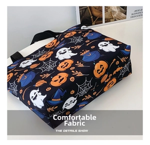 Detail showing Halloween tote bag with orange pumpkin, white ghost, and wizard hat patterns