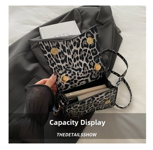 Interior view showing the large capacity and leopard print detail of the shoulder bag