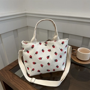 Women's corduroy tote bag with strawberry print and adjustable shoulder strap