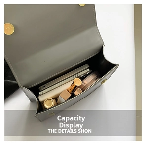 Detailed internal view of grey faux leather crossbody bag showing daily essentials storage