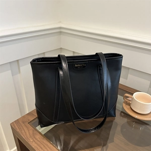 Minimalist large black tote bag in soft faux leather for women's stylish daily commute