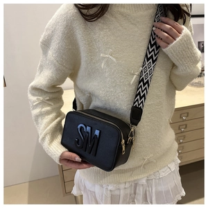 Fashionable black camera bag with SM embossed logo and geometric pattern wide shoulder strap
