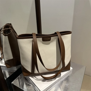 Minimalist large tote bag in white lychee leather with brown straps and contrast trim