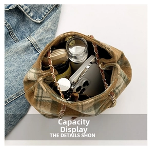 Top view of plaid bucket bag interior showing capacity for phone and cosmetics