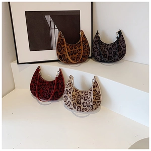 Collection of four leopard print hobo shoulder bags in various shades on display