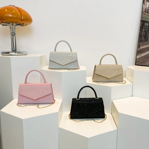 Chic rhinestone-accented evening bags in pink, silver, gold, and black with chain straps