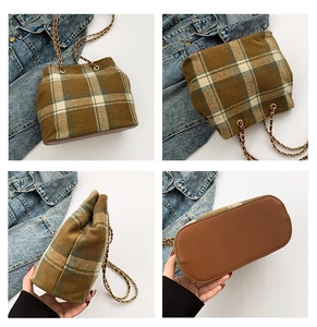Macro view of vintage plaid wool texture and leather bottom of the large chain bucket bag