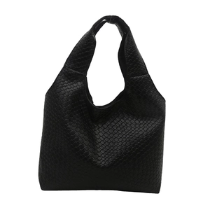 Minimalist black woven faux leather hobo tote bag with a spacious interior for commuting