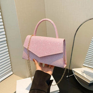 Pink sequin crossbody bag with V-shaped flap and gold chain strap for women