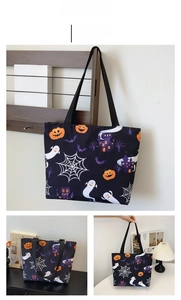 Detail of Halloween tote bag with pumpkin, ghost, and castle prints on black canvas fabric