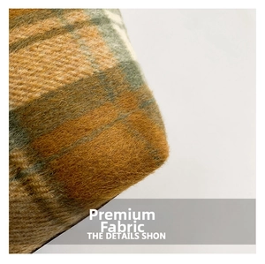 Close-up of retro plaid wool fabric with soft texture and vintage orange check pattern