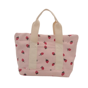 Pink corduroy strawberry print handbag with beige straps in a minimalist Japanese style