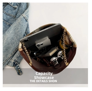 Top view of brown leather bucket bag showing large capacity for tablet and accessories