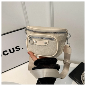 Close-up of cream crossbody bag featuring lychee texture leather and silver dual zippers