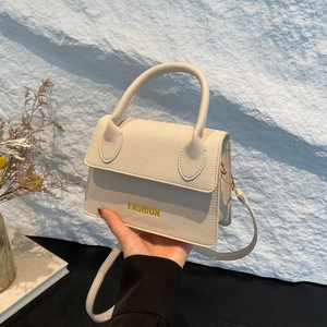 Chic beige lychee textured leather mini handbag with yellow FASHION text for women