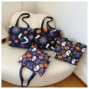 Halloween tote bags set with ghost and pumpkin patterns on dark blue canvas material