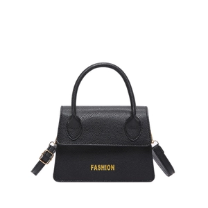 French luxury mini handbag in black pebble leather with gold letters and shoulder strap
