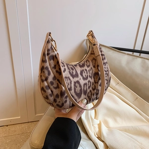 Leopard print plush hobo bag with moon-shaped design and gold zipper detail