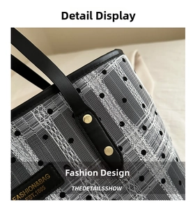 Close-up of vintage polka dot lace tote bag with leather handle and metal rivets