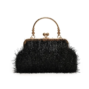 Black tassel evening shell bag with golden metal handle and sphere clasp closure