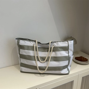 Spacious striped canvas tote bag with cotton rope handles for travel and daily commute