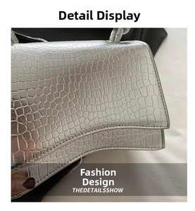 Detailed macro view of the silver crocodile pattern texture and curved base design