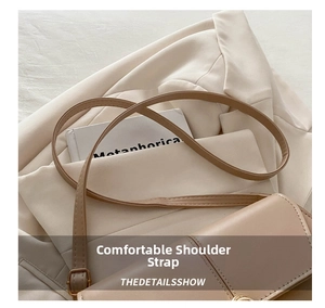 Detail of adjustable leather strap and stitching on beige minimalist square handbag