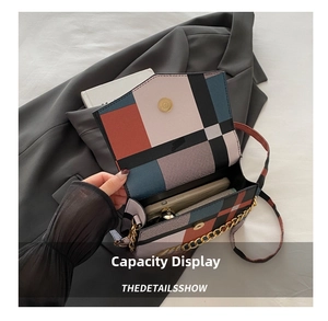 Detail showing the internal storage capacity of the color-block crossbody bag