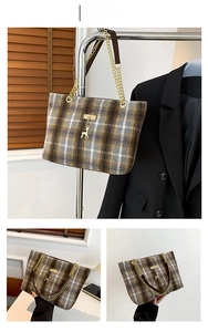 Detail view of grey woolen plaid tote bag featuring golden chain strap and deer pendant