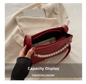 Detail shot of the red PU leather handbag interior showcasing spacious capacity for essentials