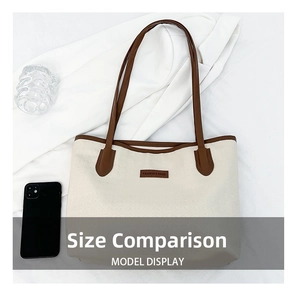 Large off-white canvas tote bag with brown leather handles and side size comparison