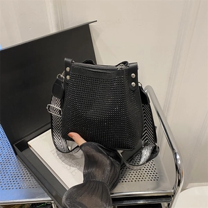 Elegant black bucket bag with sparkling rhinestones and chevron strap in a gift box