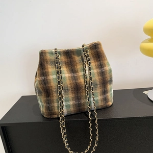 Plaid wool bucket bag with gold chain strap in brown and green tartan pattern