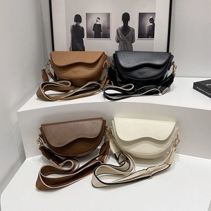 Vintage leather saddle bags in four colors with stylish wave flap and wide strap