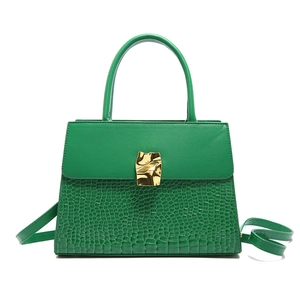 Emerald green crocodile pattern leather handbag with golden metal buckle clasp