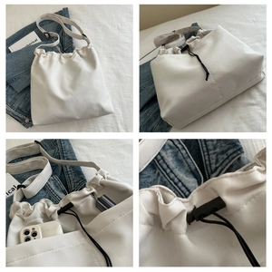 Detailed views of white drawstring tote bag showing inner pockets and waterproof fabric