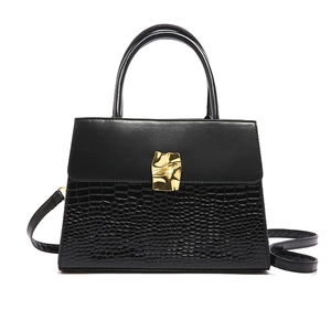 Chic black crocodile embossed crossbody bag with gold buckle and adjustable strap