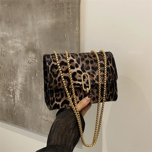 Fashionable leopard print crossbody bag with gold chain strap and oval lock closure