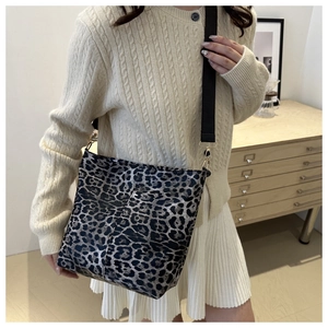 Leopard print canvas tote bag with wide strap and gold hardware for women