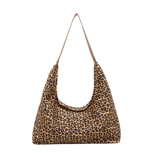 Large leopard print tote bag with brown shoulder strap in a stylish hobo design