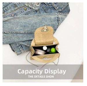 Internal view of beige mini crossbody bag showing storage space for makeup items